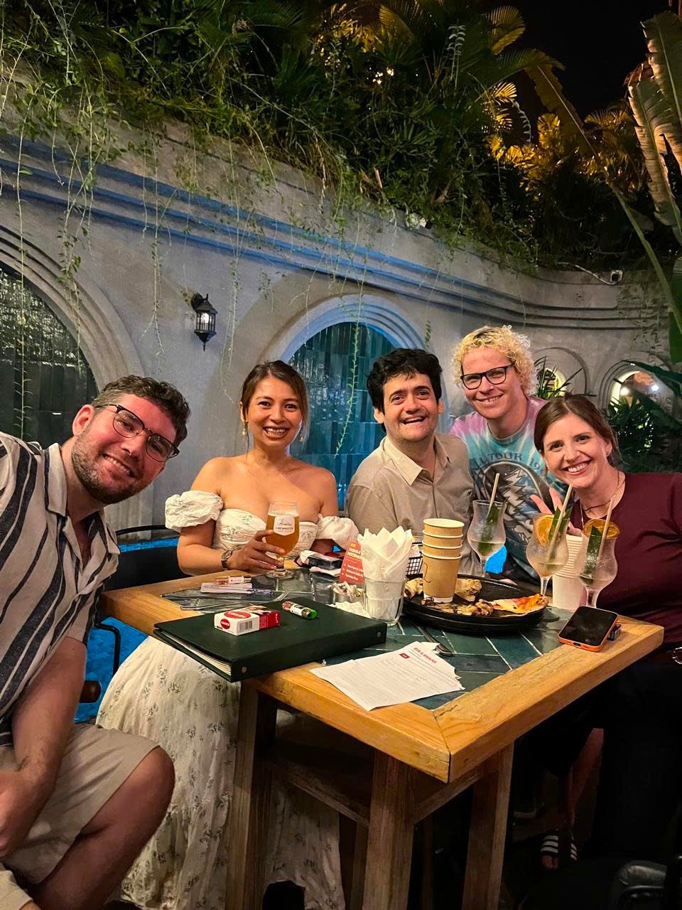Tequila Mockingbird, night one 2nd place, smiling round their table at The Palm